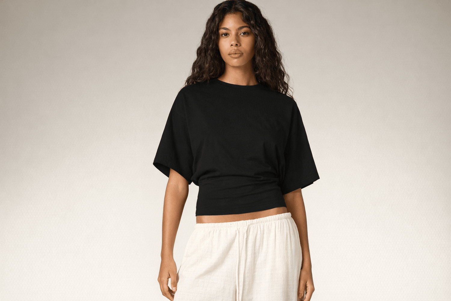 IdyllVie Relaxed Batwing Cotton Tee in Black t-shirt foundation on-model front angled with refined IdyllVie styling