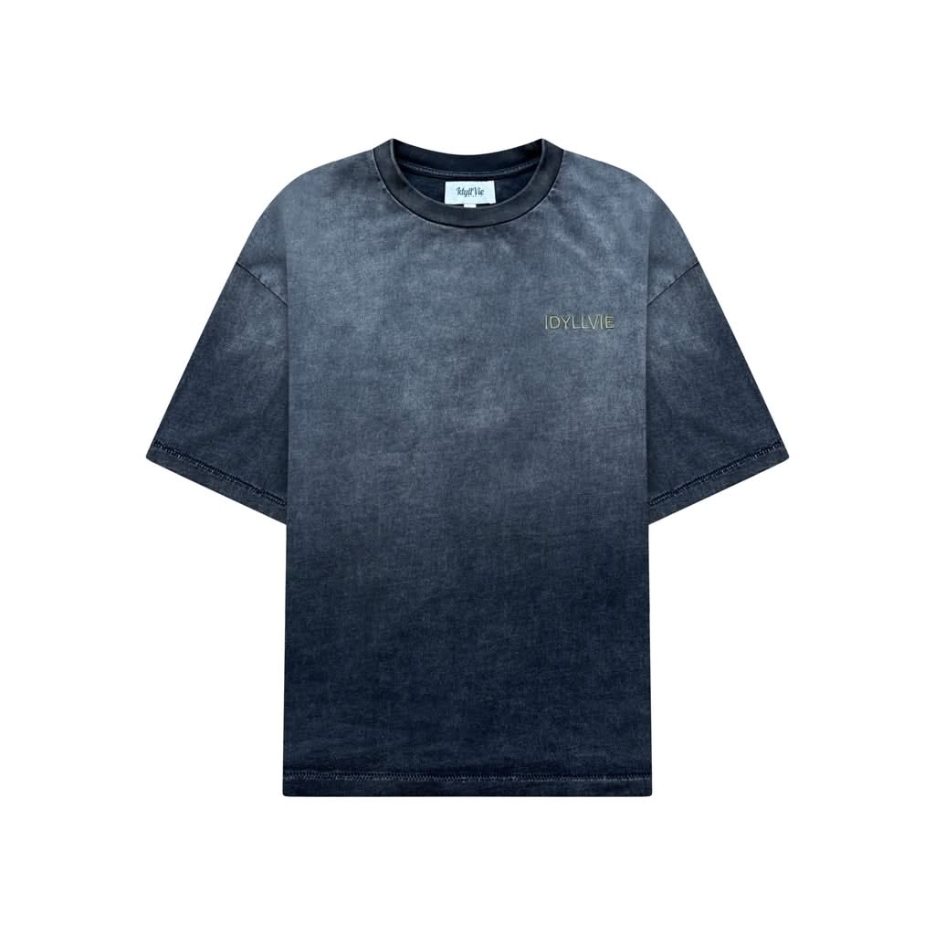 Front view of the 101 IdyllVie Studio Tee, a heavyweight cotton t-shirt with a vintage washed black finish and minimalist chest logo.