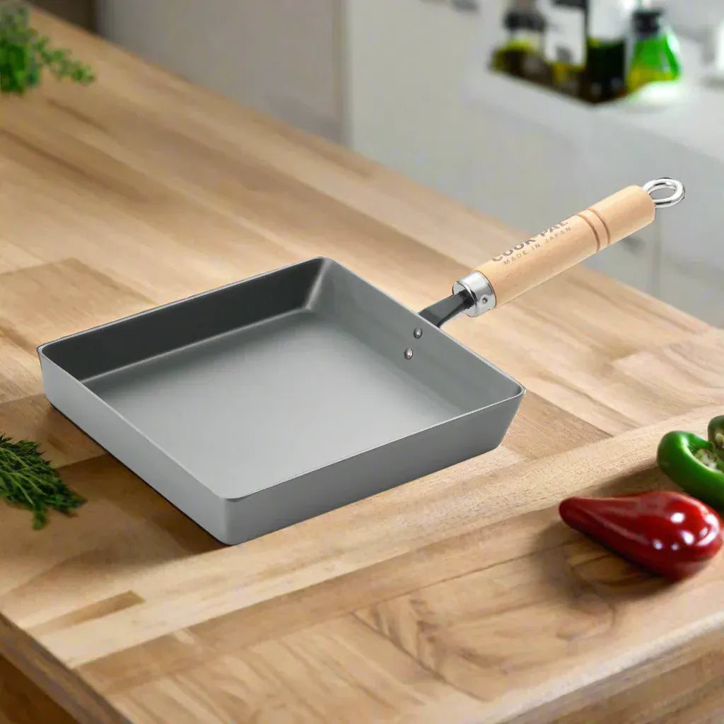 Yoshikawa Cook-Pal Ren Rolled Egg/Omelet Pan (Large)– Nitrided Carbon Steel, Made in Japan in wood, fit and styling view showing cookware shape