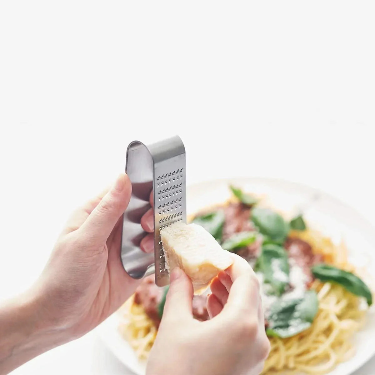 Eatoco Oros Handy Grater – Japanese Stainless Steel Compact Condiment Zester in stainless steel, front product view showing cookware shape