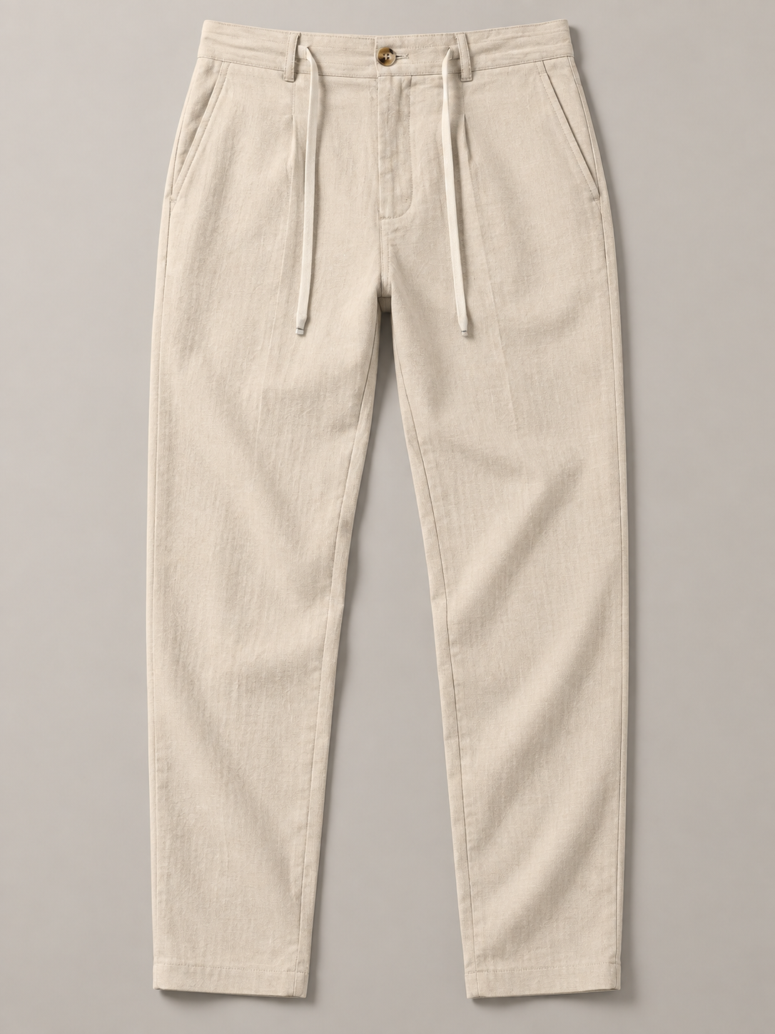 Apricot button-front drawstring trousers, flat front view.