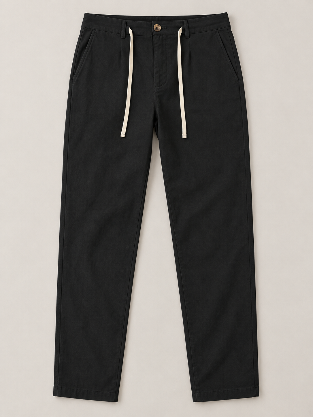 Black button-front drawstring trousers, flat lay front.