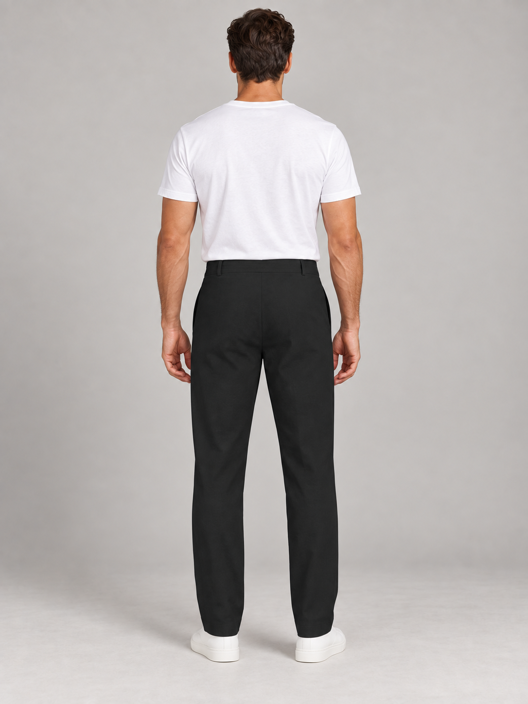 Black button-front drawstring trousers, model back.