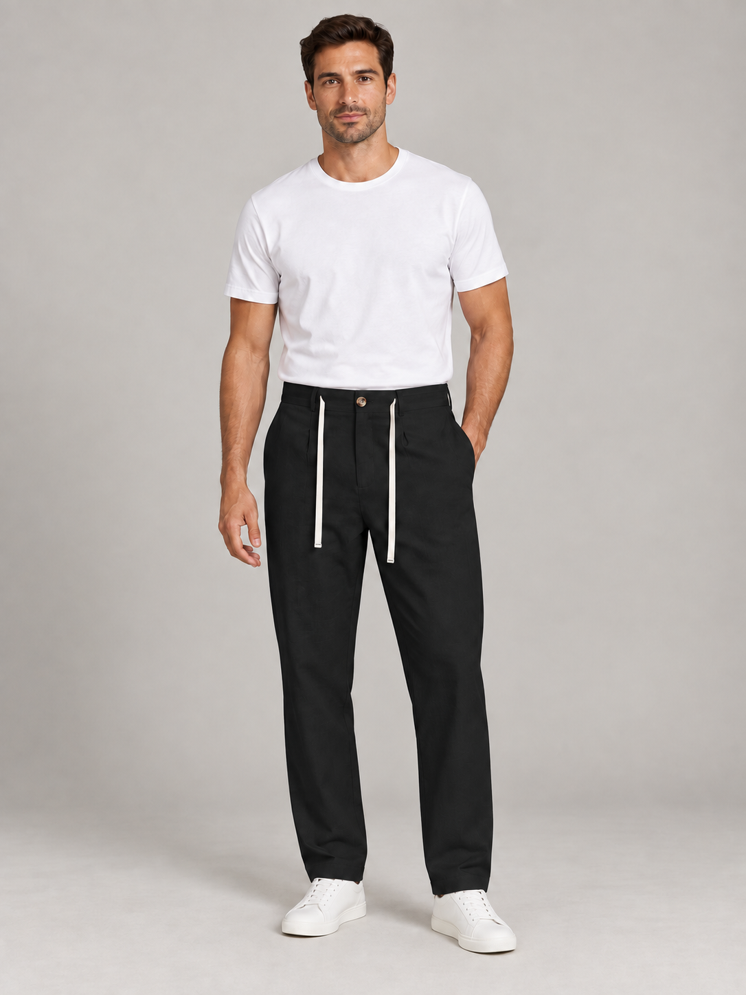 Black button-front drawstring trousers, model front.