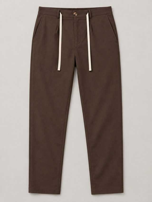 Brown drawstring trousers, flat front with button waist and side pockets.