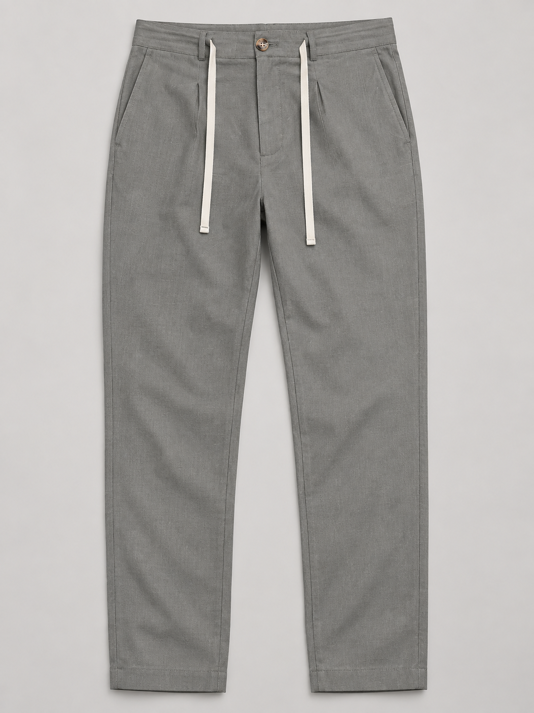 Grey drawstring trousers, flat front with button waist and side pockets.