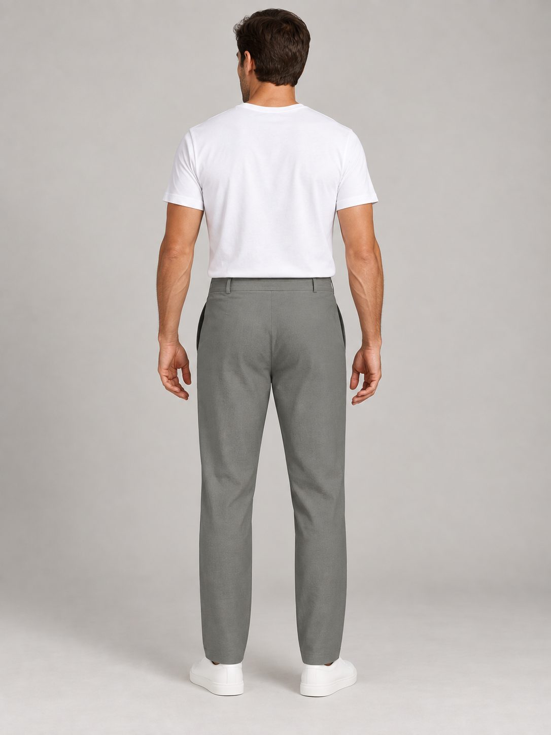Grey drawstring trousers, plain back view on a model.