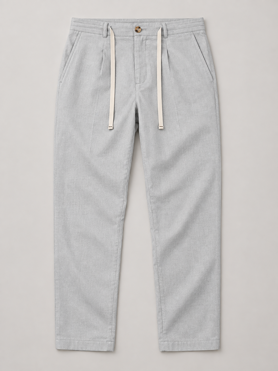 Light Grey drawstring trousers, flat front with button waist and side pockets.