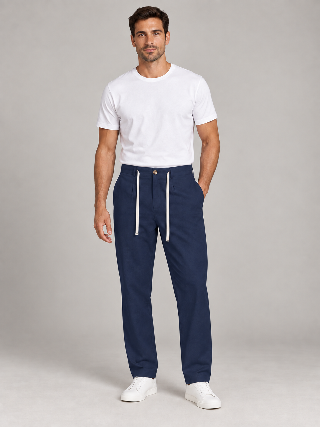 Navy Blue button-front drawstring trousers, model front.