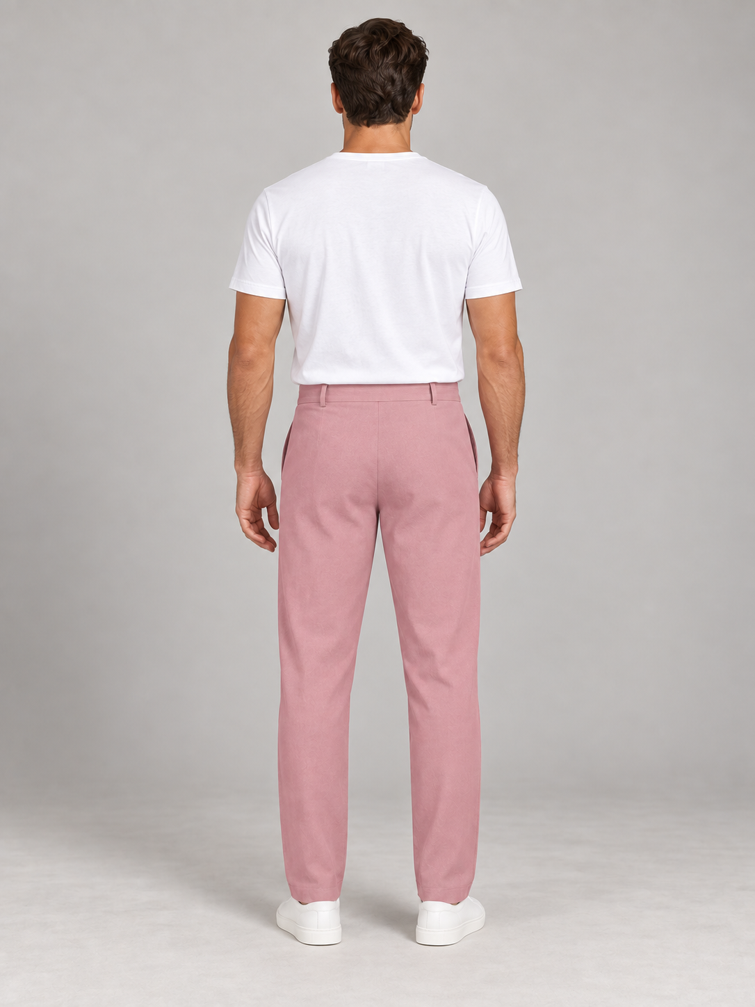 Pink button-front drawstring trousers, model back.