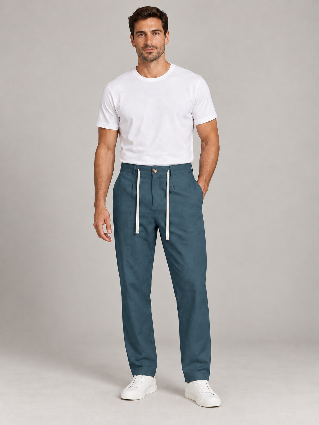 Teal Blue drawstring trousers, front view on a model.