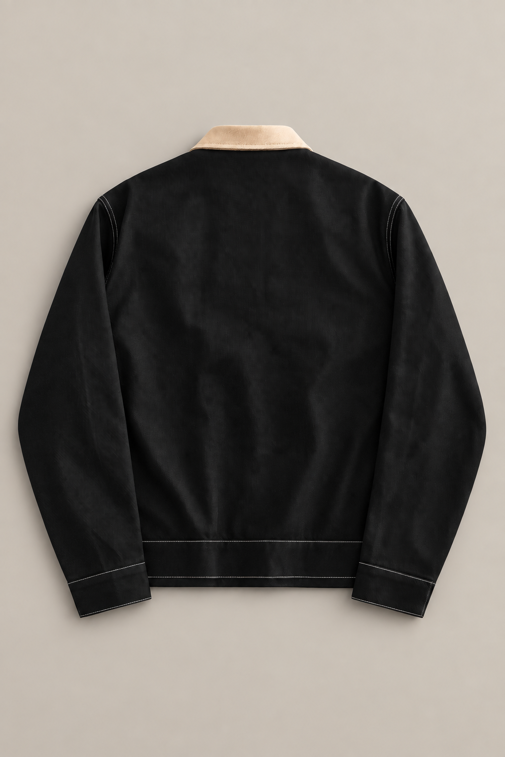 Black cotton contrast-collar jacket, flat back with plain panel and stitched hem.