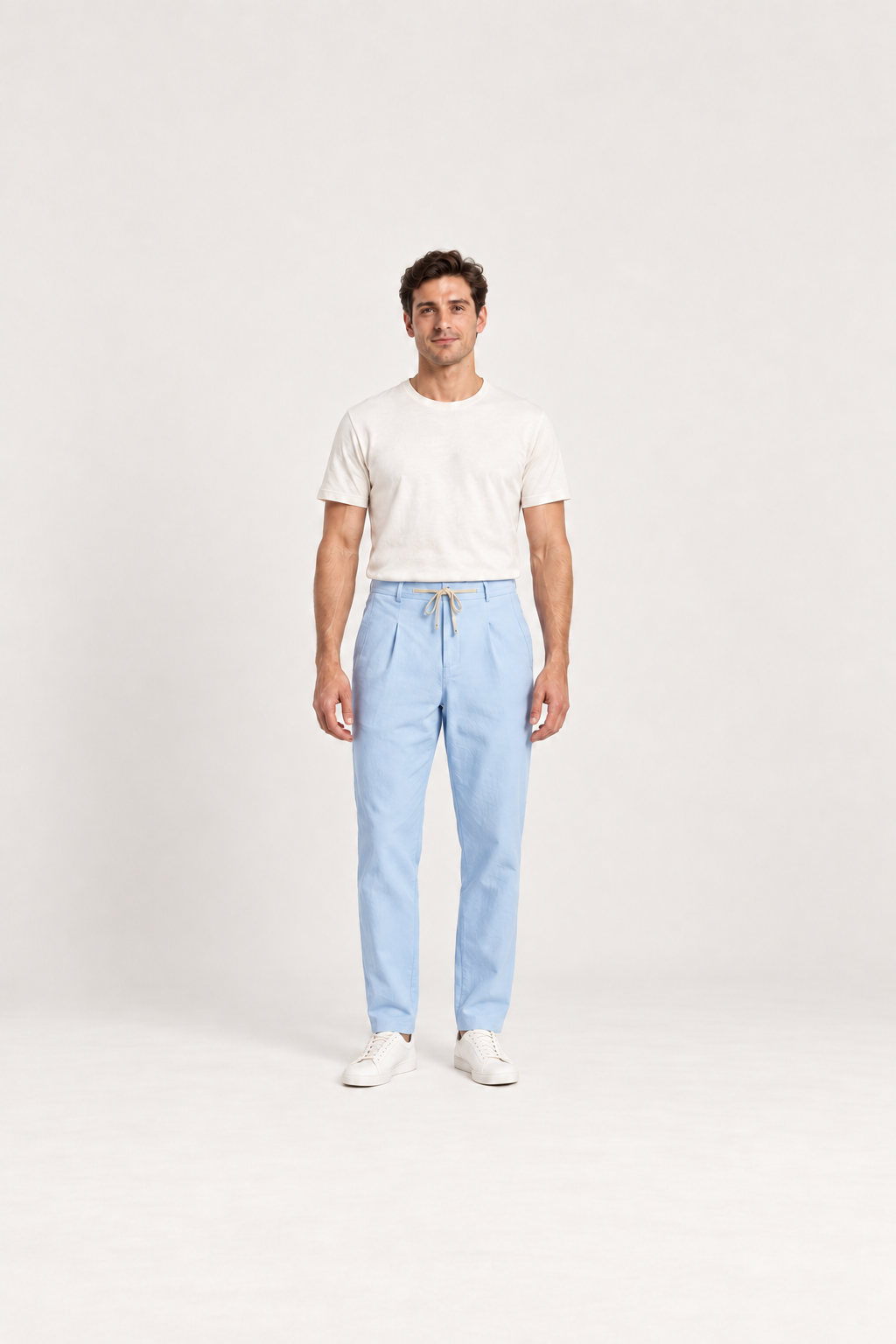 Baby Blue cotton pleated drawstring pants, front view on an adult model.
