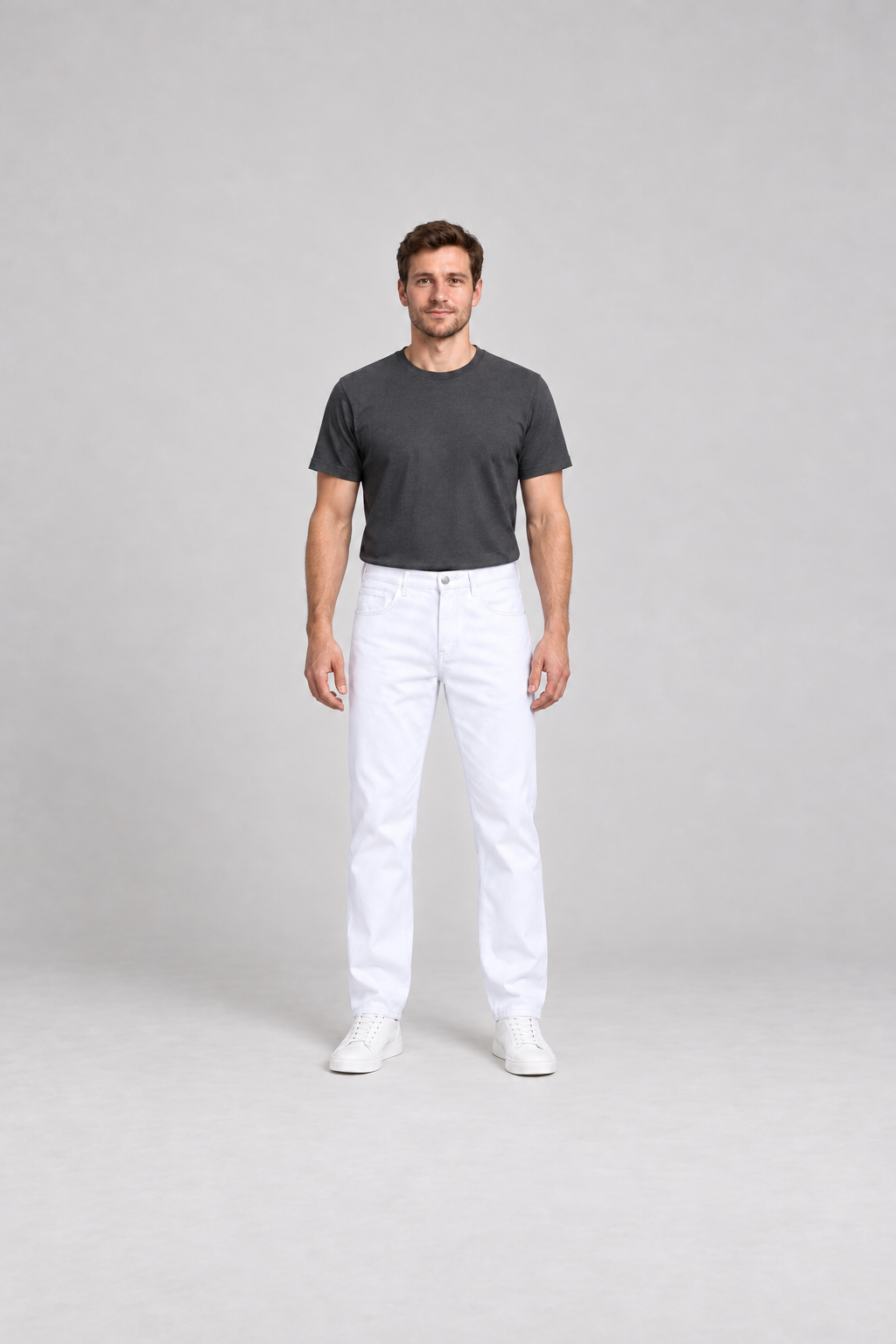 Front view of white straight-leg jeans on a model with a charcoal tee.