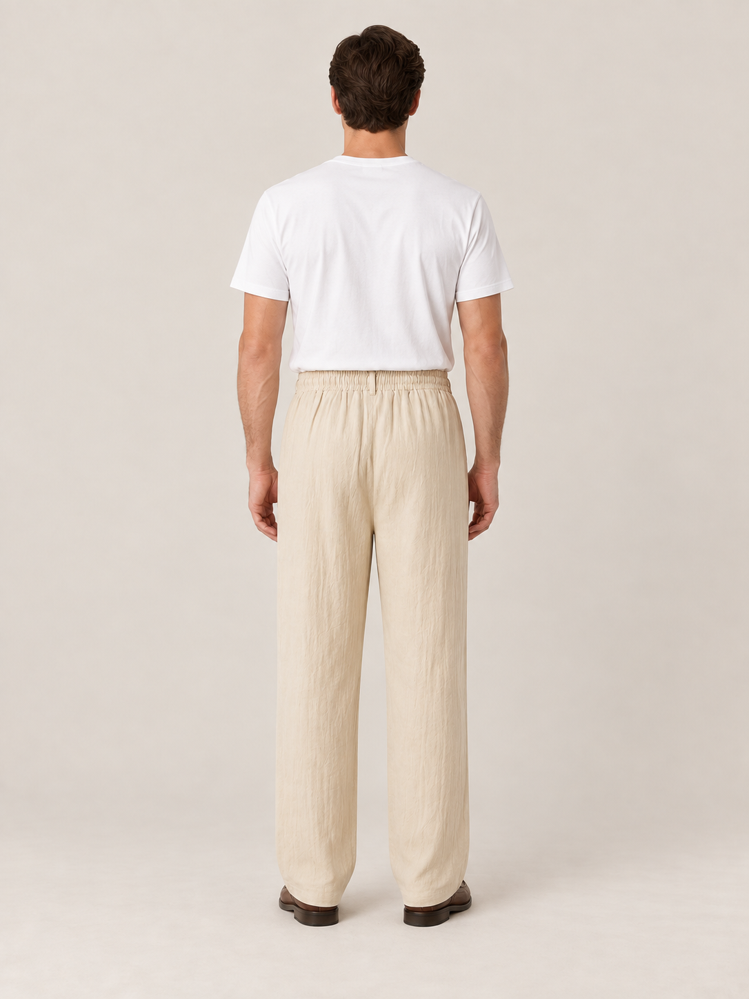 Khaki woven drawstring trousers, back view on a model.