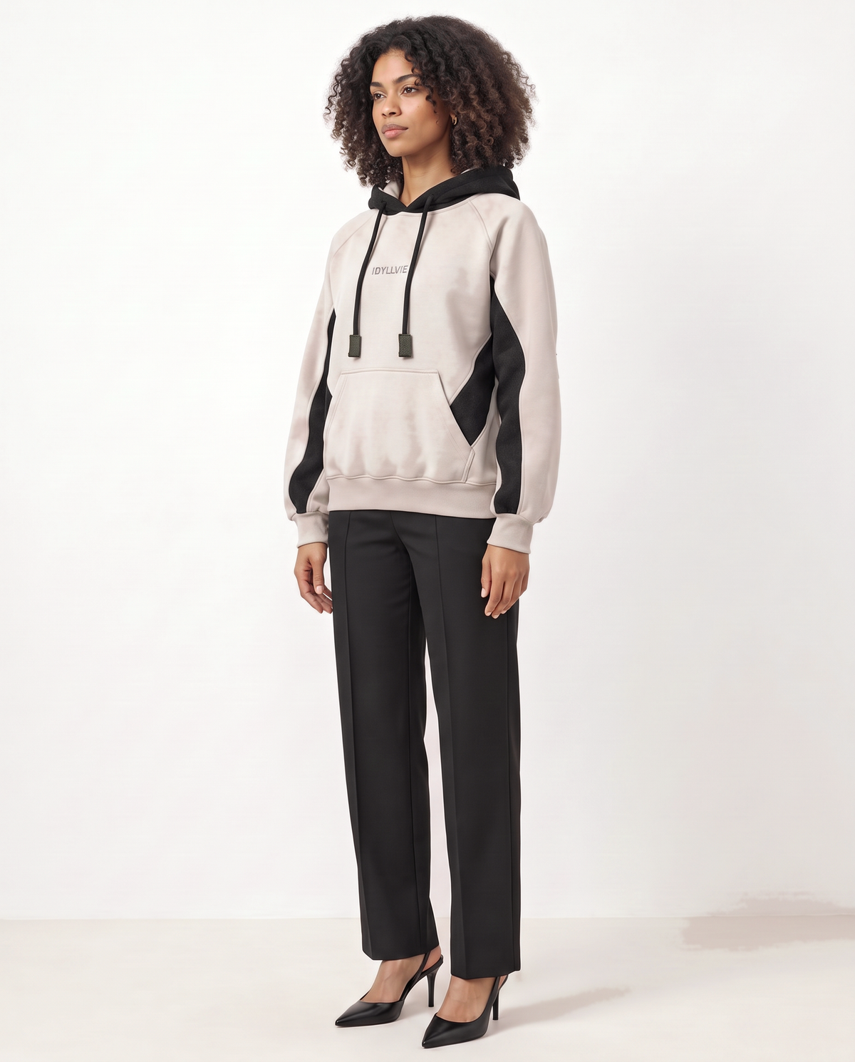 Hutton Cotton & Merino Panelled Hoodie — female model three-quarter (updated October 2026)