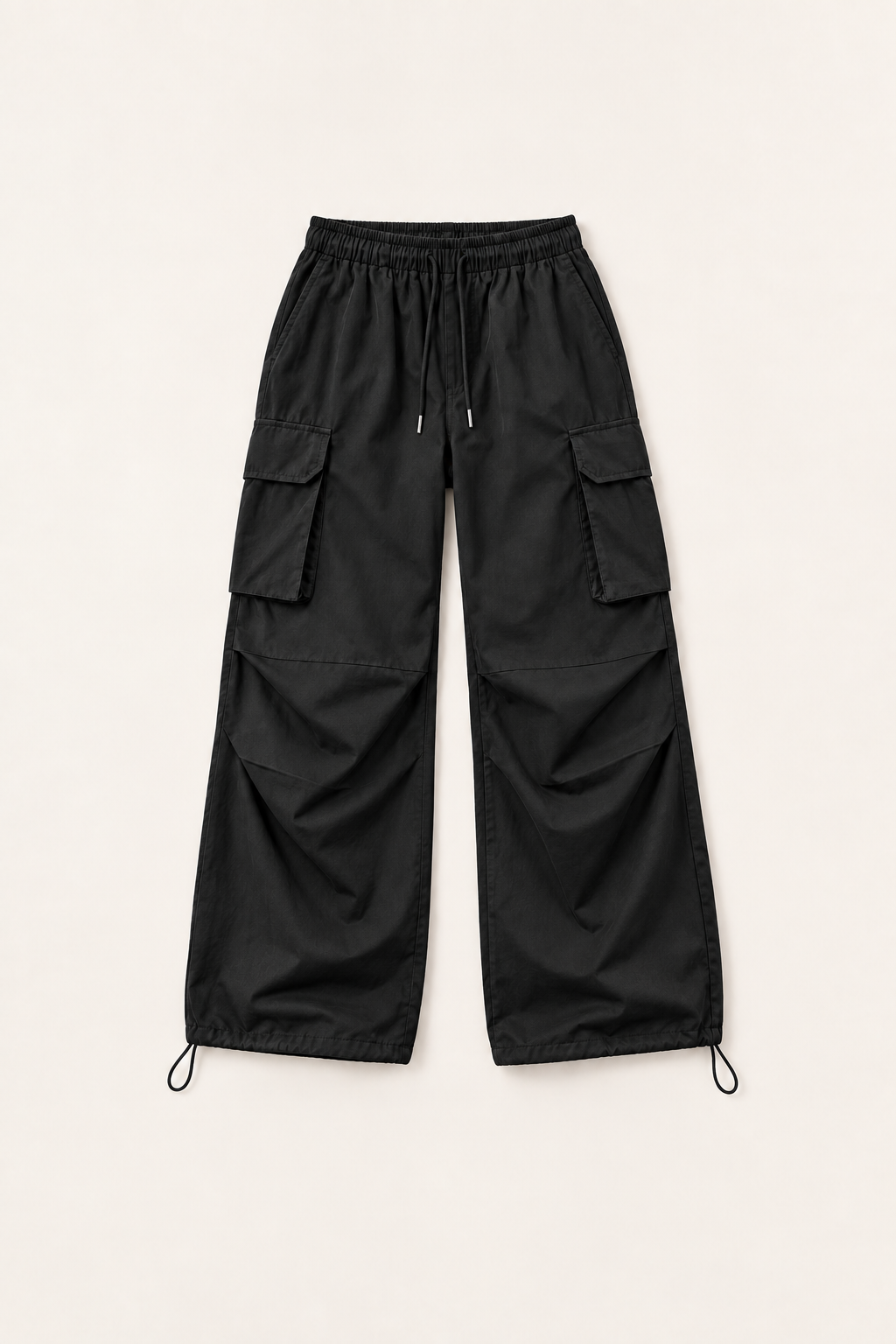 Black cotton drawstring cargo pants, flat lay front.