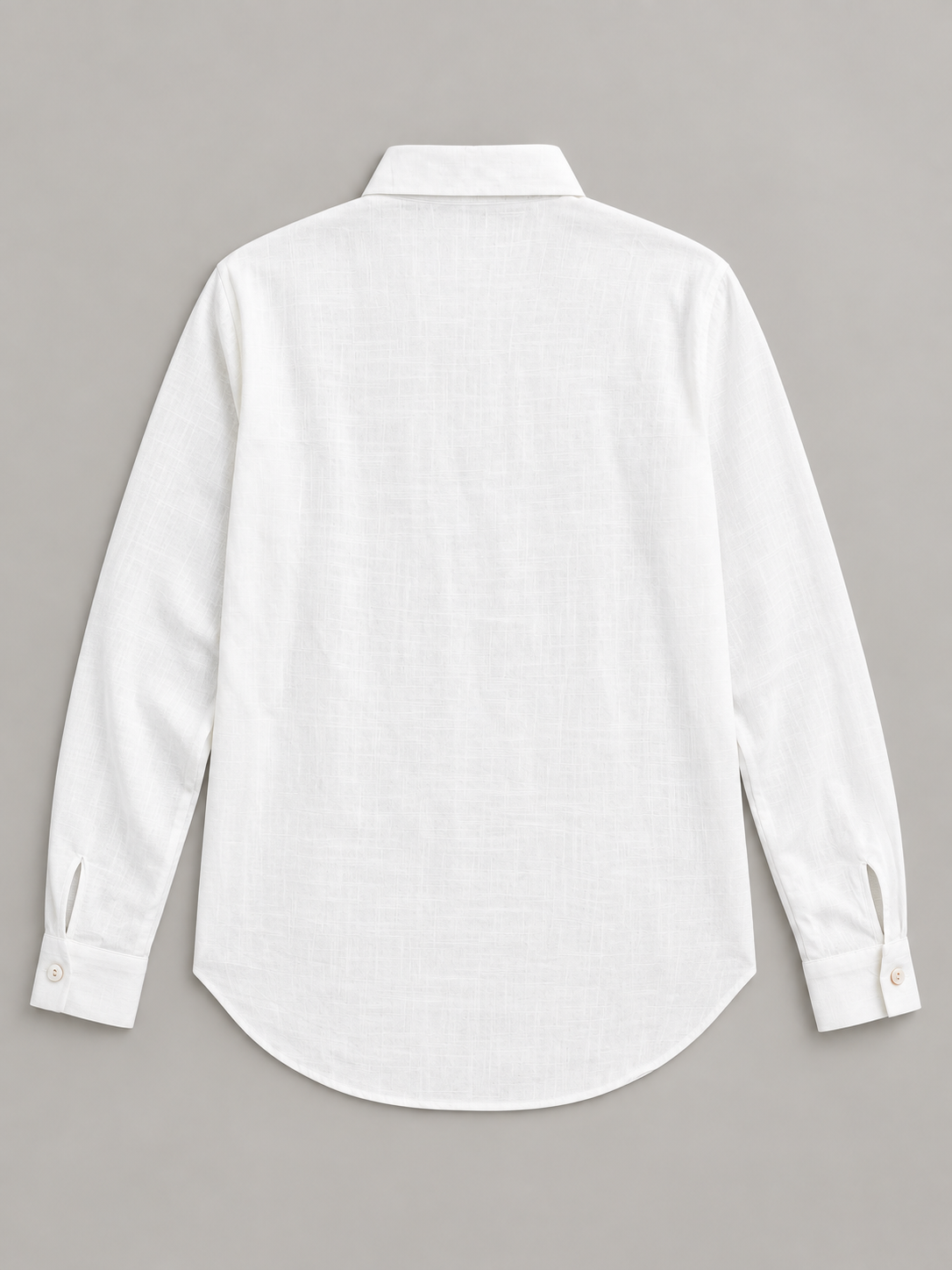 White shirt with pale floral embroidery on the left front, flat lay back.