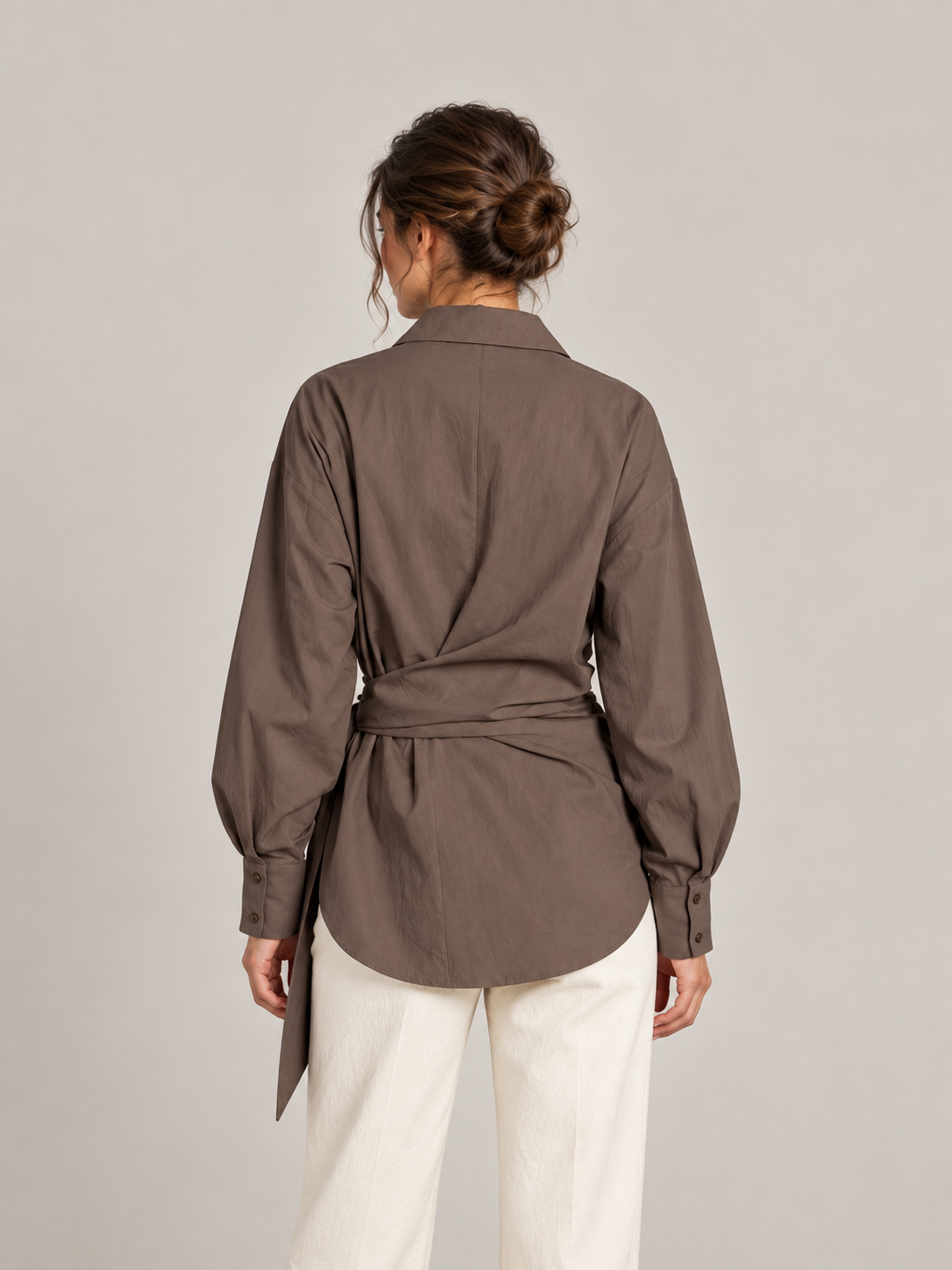 Brown cotton tie-waist shirt, model back.