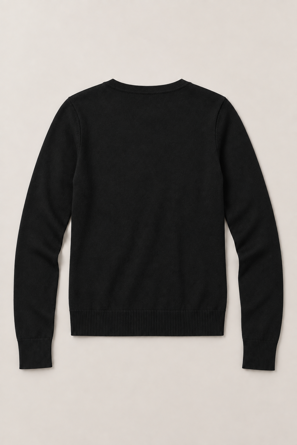 Black cardigan laid flat from the back, showing a plain back and ribbed hem.