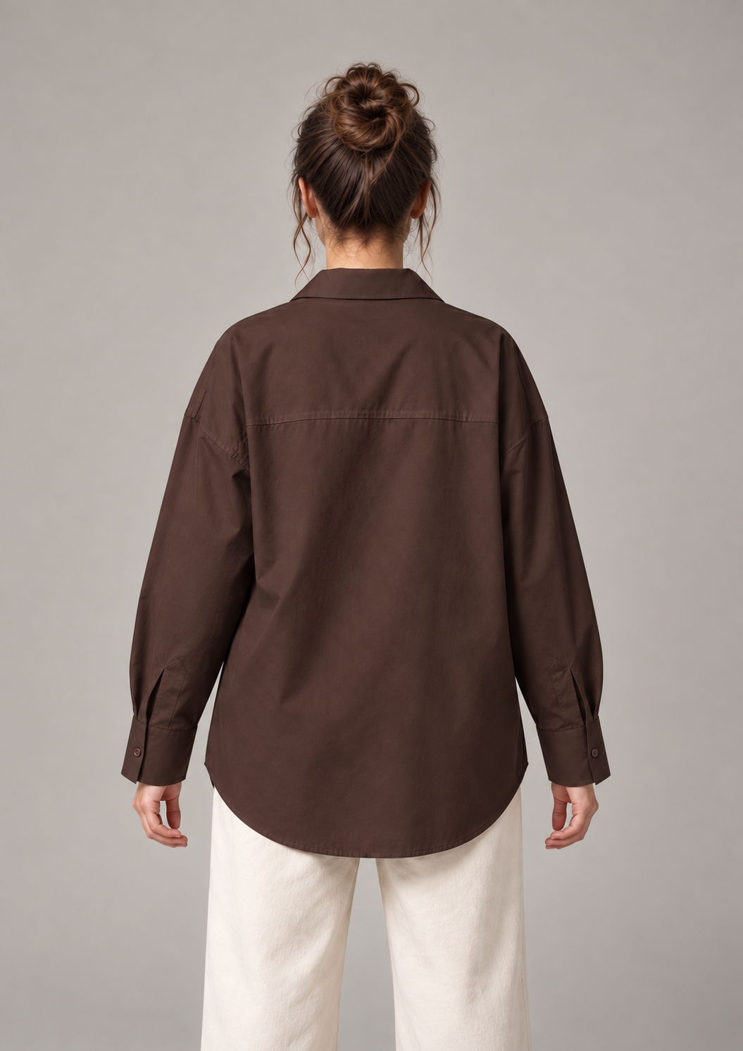 Chocolate brown oversized button-up shirt, back on an original model showing the horizontal shoulder yoke.