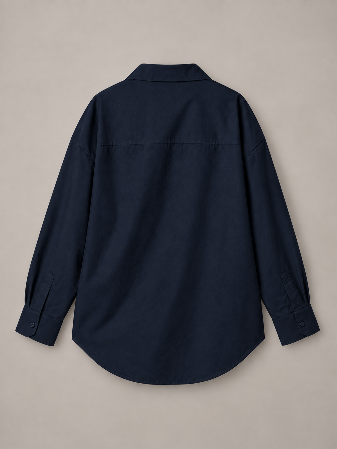 Navy blue oversized button-up shirt, flat back showing the horizontal shoulder yoke.