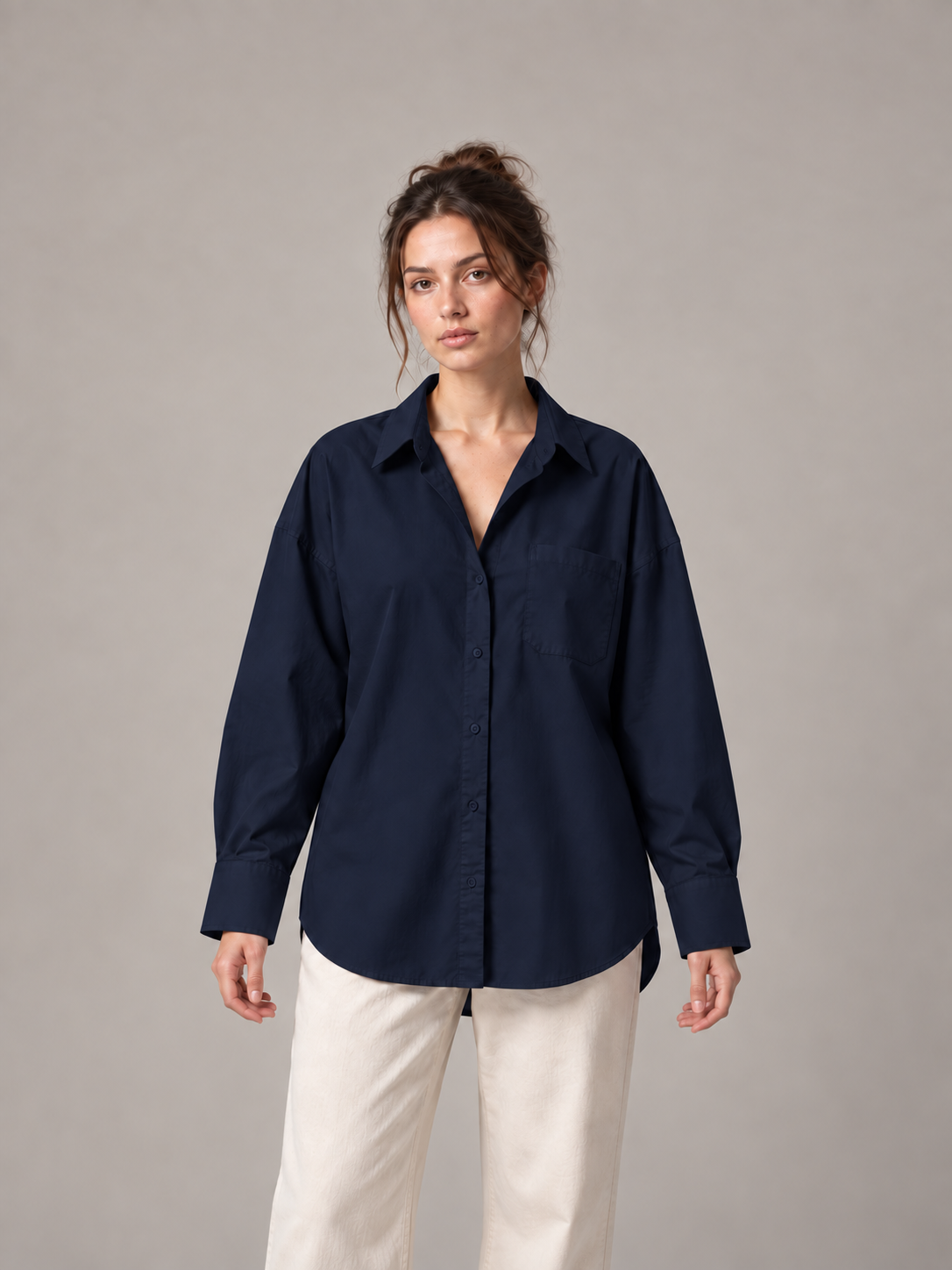 Navy blue oversized button-up shirt, front on an original model with a chest patch pocket.