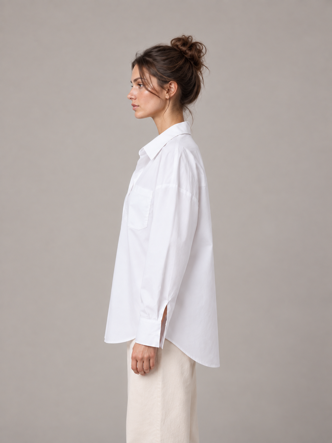 White oversized button-up shirt, model side