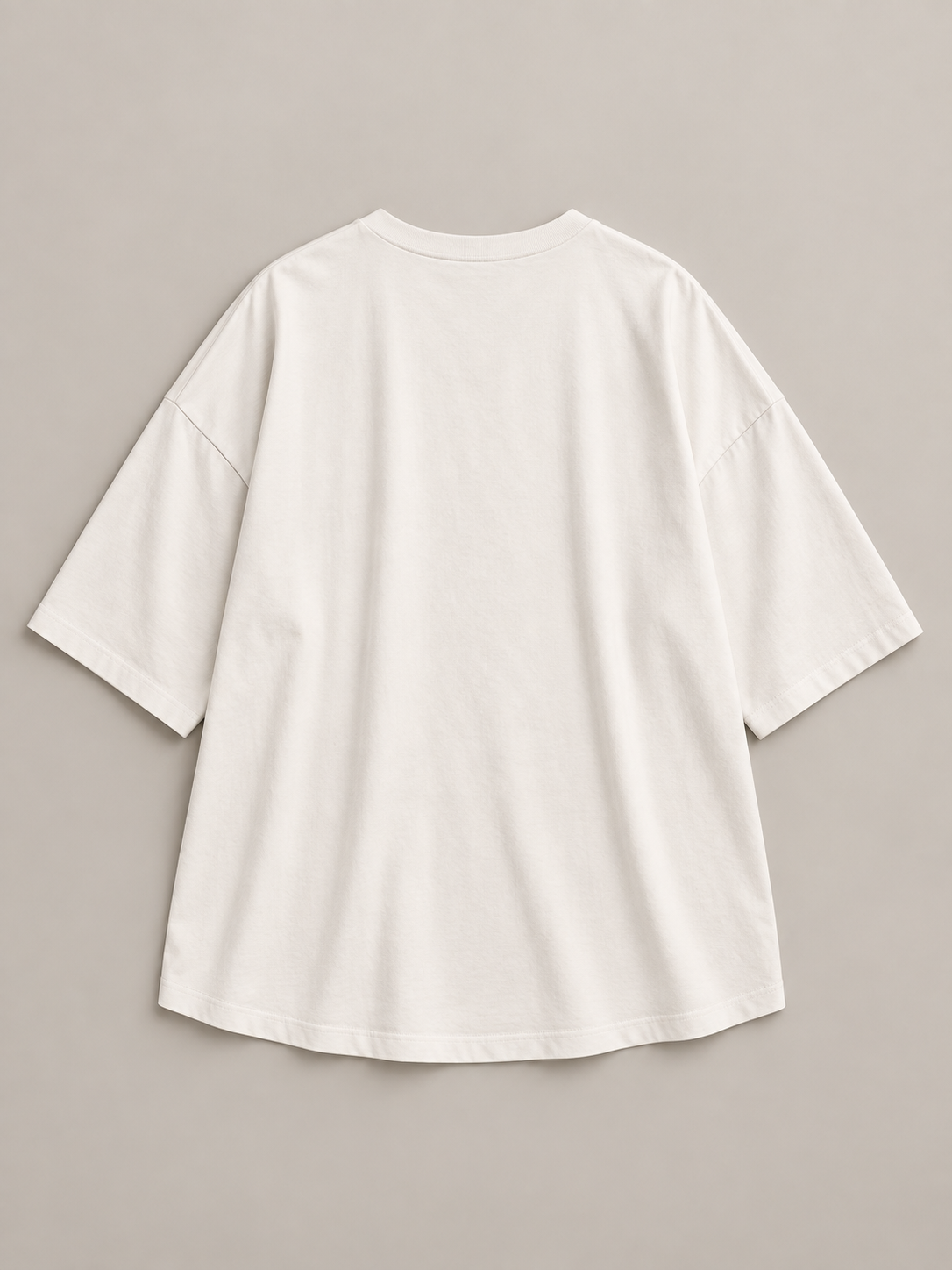 White oversized cotton half-sleeve T-shirt, rear flat lay.