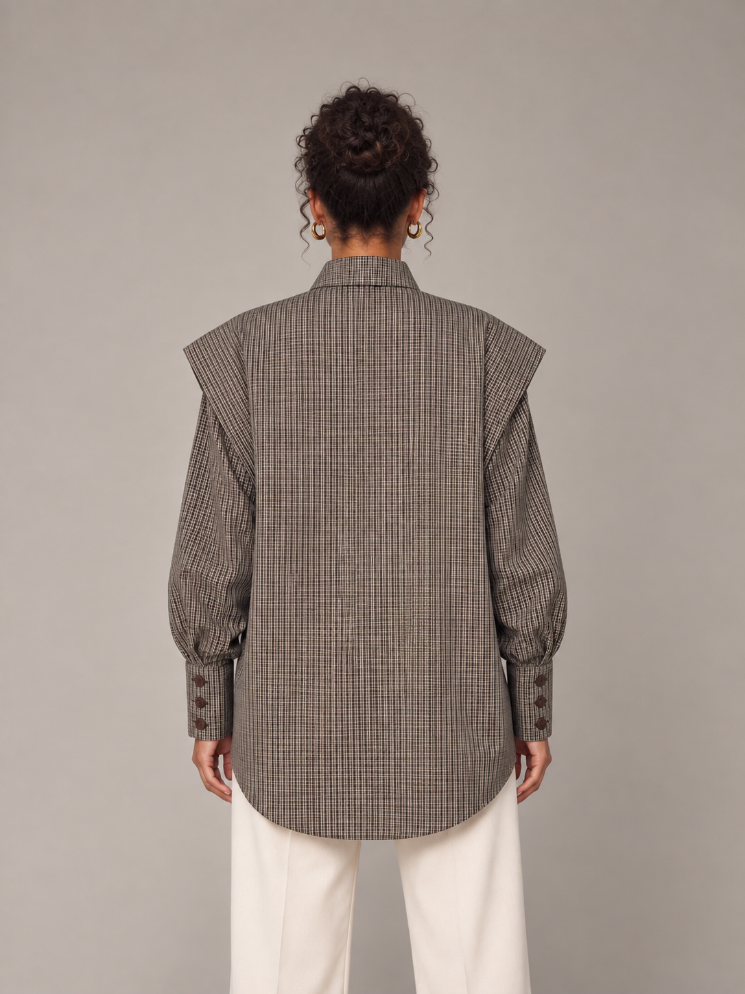 Coffee Brown plaid tie-neck shirt with folded shoulders, model back.