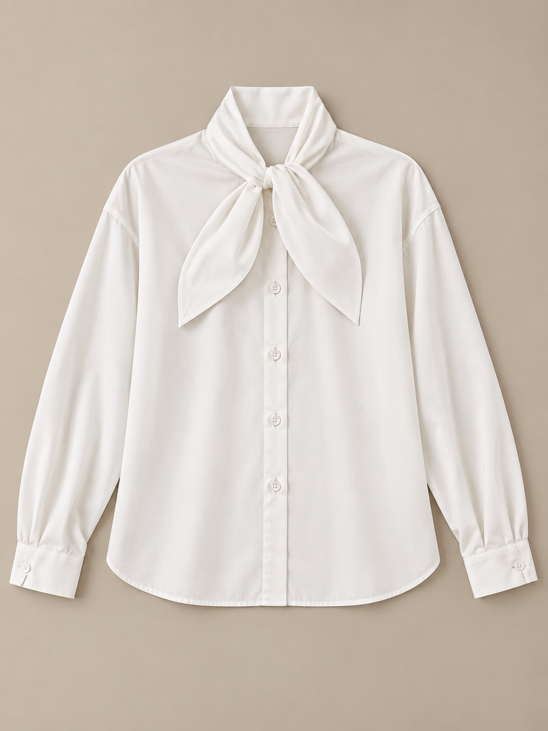 White tie-neck button-front blouse, flat lay front.