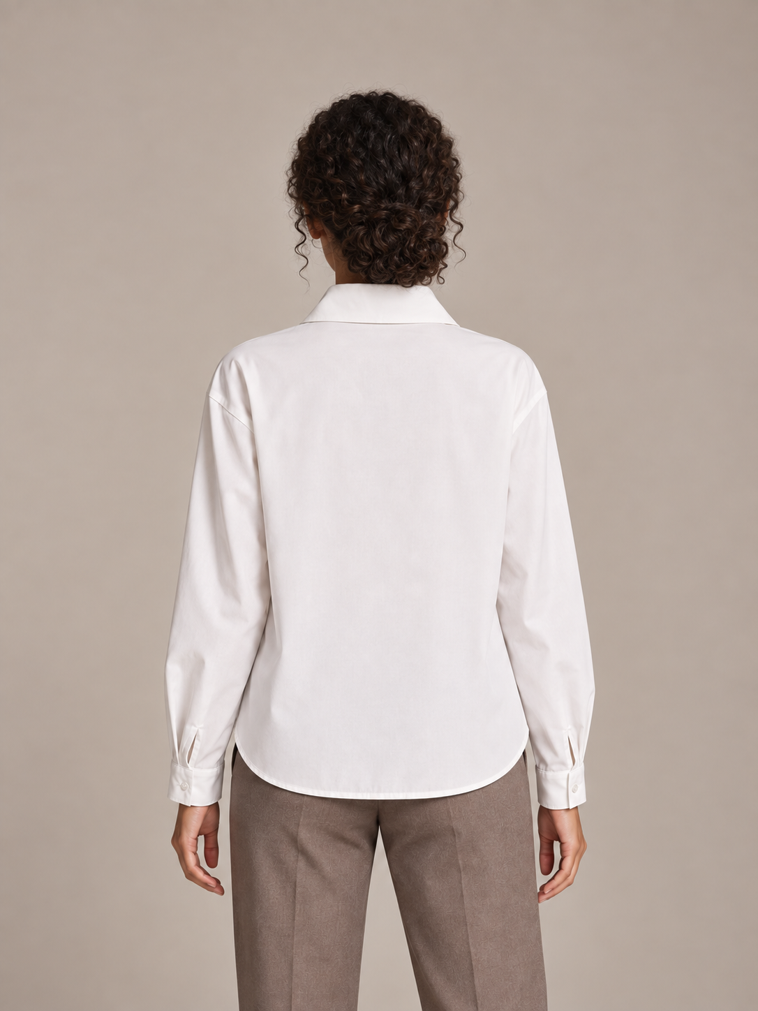 White tie-neck button-front blouse, model back.