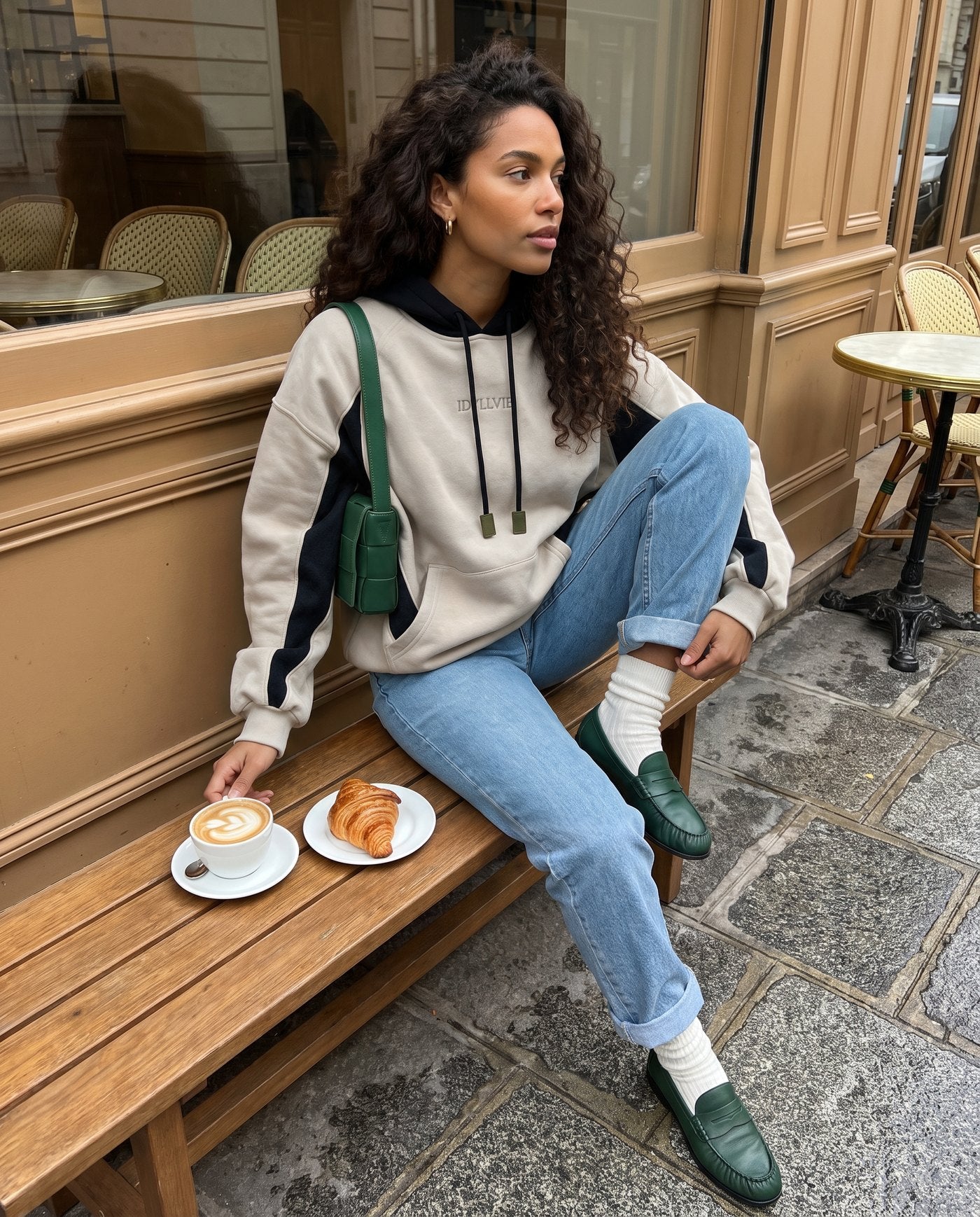 Hutton cotton and merino hoodie styled outside a cafe